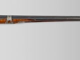 an old gun with a wooden handle on a white background