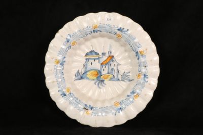 a plate with a picture of a castle on it