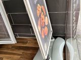 a picture of a sign on the corner of a bathroom