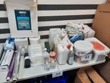 a table with a lot of supplies on it in a room