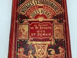 the front cover of a red book with gold trimmings on it