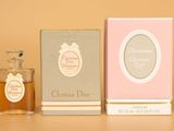 three bottles of perfume sitting next to each other on a table