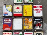 a lot of different types of gas cans on the floor