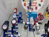 a lot of watches on display in a glass case