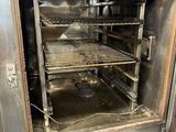 an oven that has a lot of food inside of it