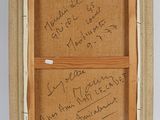 an old picture frame with writing on it and a note attached to it