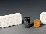 three different types of soap on a table next to a penny