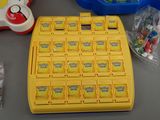 a yellow game board that has a lot of items on it