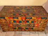 a wooden box that has a colorful design on it
