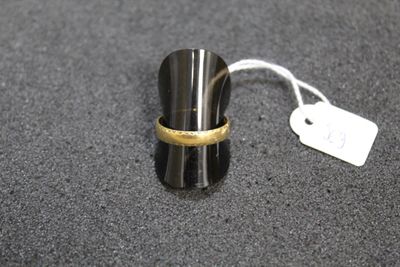 a close up of a ring on a table with a price tag