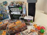 a lot of toys on a table with a speaker