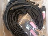 a black cord with pink cords in a plastic bag