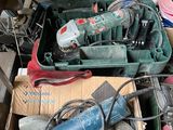 a box full of tools that are sitting on the ground