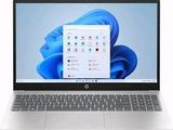 l'ordinateur portable est ouvert sur un fond blanc avec un fond bleu