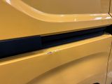 a close up of a car door handle with a sticker on it