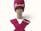 purple knitted hat and gloves with name on it on a mannequin head