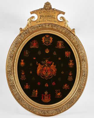 an ornate gold frame with a black and red design on it