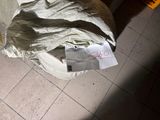 a sheet of paper on the floor next to a chair
