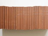 a lot of books that are stacked on top of each other