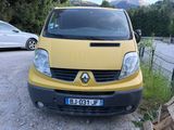 a yellow van that is parked in a parking lot