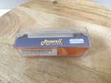 a box of oranges sitting on a wooden table