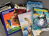 a lot of books that are sitting on a table