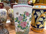 several vases are sitting on a table in a store