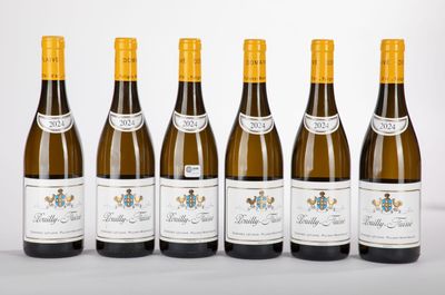 six bottles of wine are lined up in a row on a table