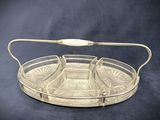 an image of a glass tray with a handle on a black background