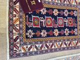 an image of a rug with a passport on top of it