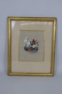 painting of a vase of flowers in a gold frame on a white wall