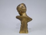 bronze bust of a young boy with his back turned to the camera