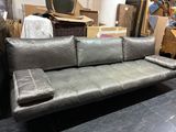 a couch that is sitting in the middle of a room