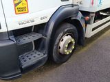 a large white truck parked on the side of the road