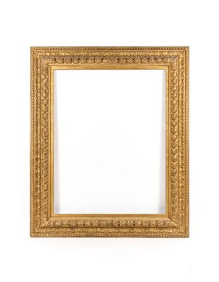 a gold frame on a white wall with a white background