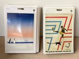 two boxes of nintendo wii games on a wooden table