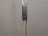 a metal pole that has a glass tube on it