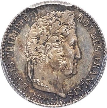 a silver coin with a woman ' s head on it