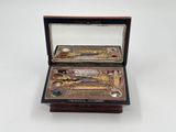 a box with a pair of scissors inside of it