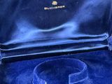 an image of a blue box with a ring inside of it