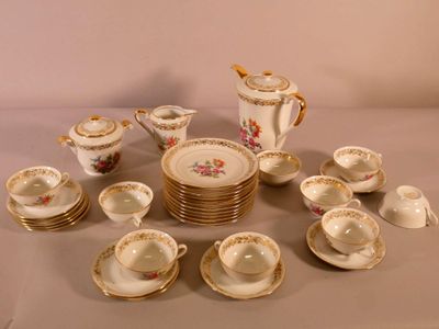 a lot of plates and cups that are on a table