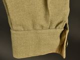 a close up view of the back of a khaki shirt