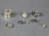a lot of rings that are sitting on a table