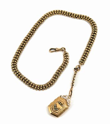 une chaîne en or sur laquelle est accroché un cadenas, auquel est attachée une autre chaîne