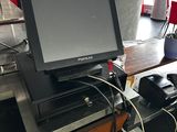 a computer monitor sitting on top of a desk in a room