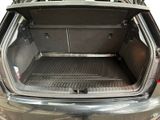 a trunk of a car with the back door open