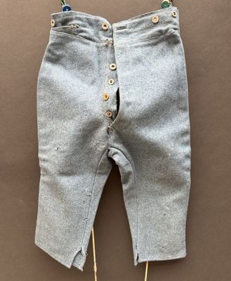 a close up of a pair of pants with buttons on them