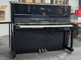 a piano that is sitting in a room