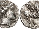 a silver coin with an image of a horse on it