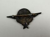 a small metal object with a knife on it